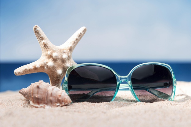 front-view-beach-with-sunglasses-starfish_23-2148557665